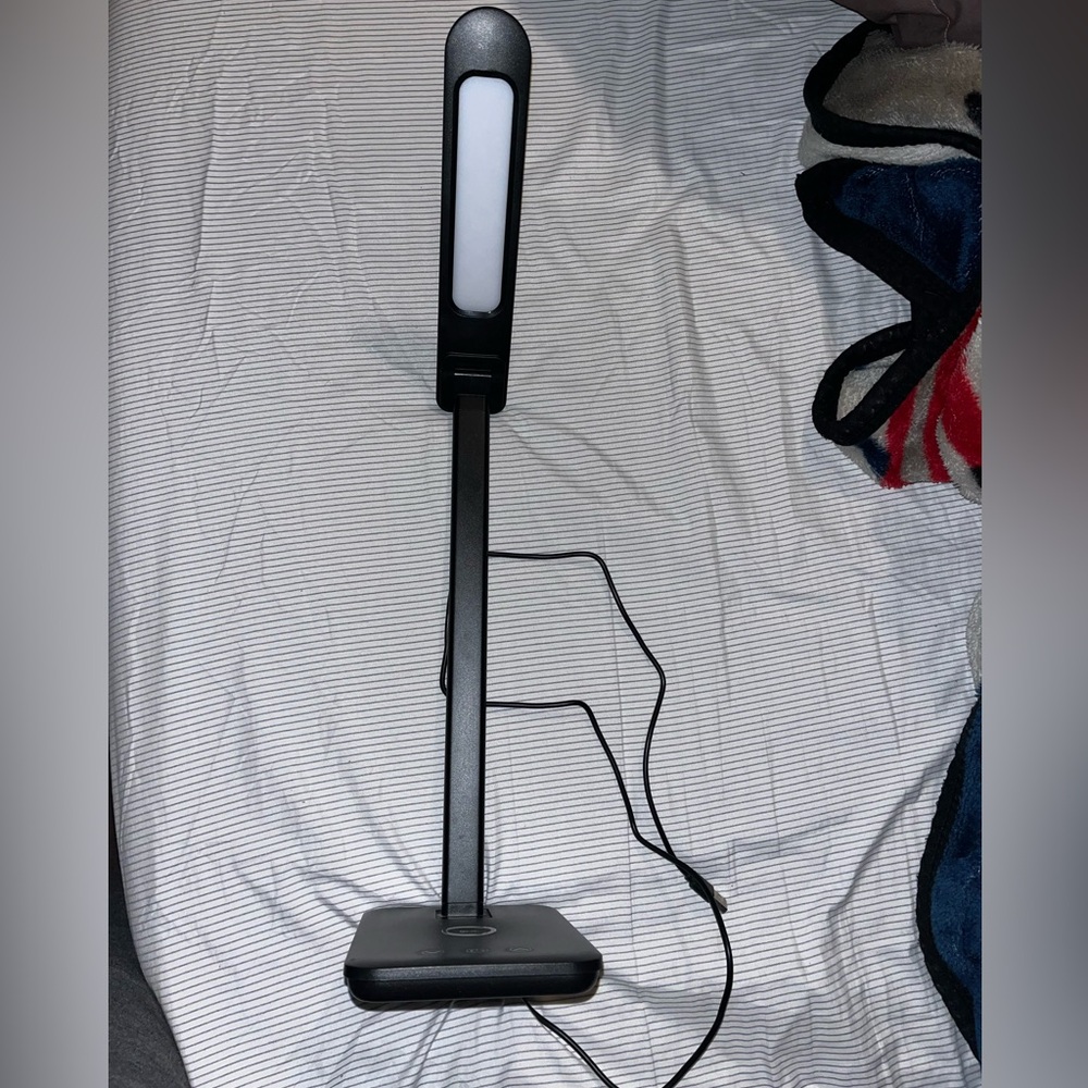 Wireless phone charging lamp